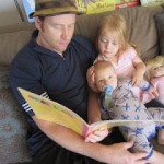 A father reads to his children