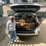 Volunteer Delivering Books