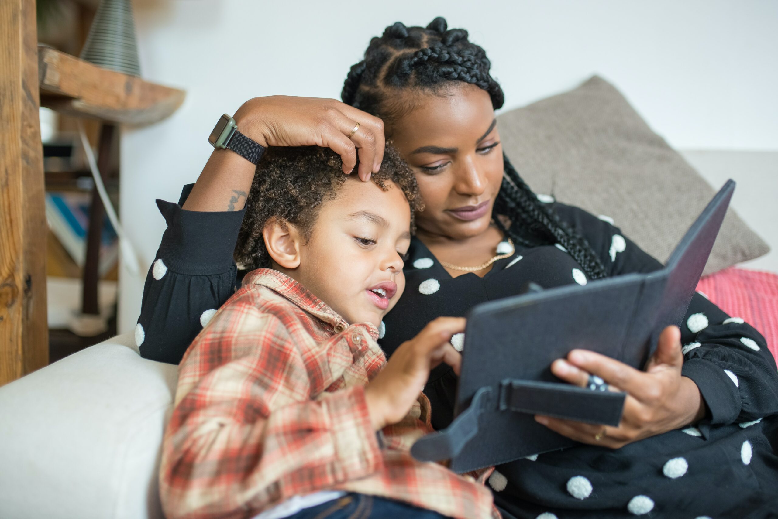 Mom and son reading on a tablet by Kampus production via Pexels