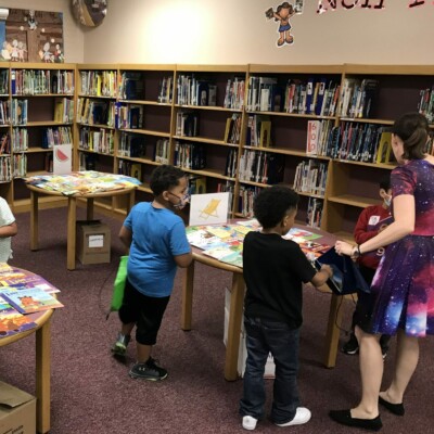 Program Director Shannon Thorne helps Smith students choose their Summer Success books.