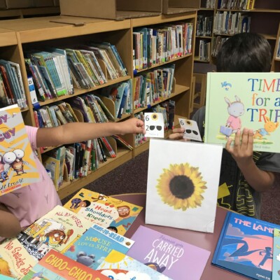 Smith students shop at the "Sunflower" table for their Summer Success books.